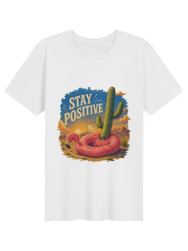 Stay Positive funny t-shirt in white with a flamingo pool float punctured by a desert cactus, by LOLsies